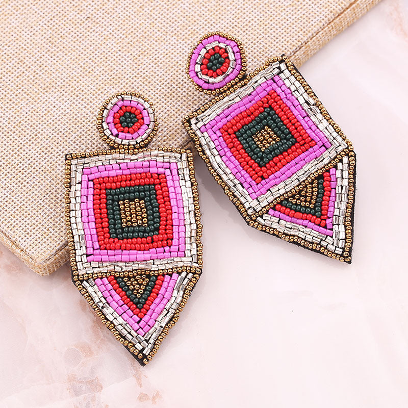 Handmade rice bead earrings in pink
