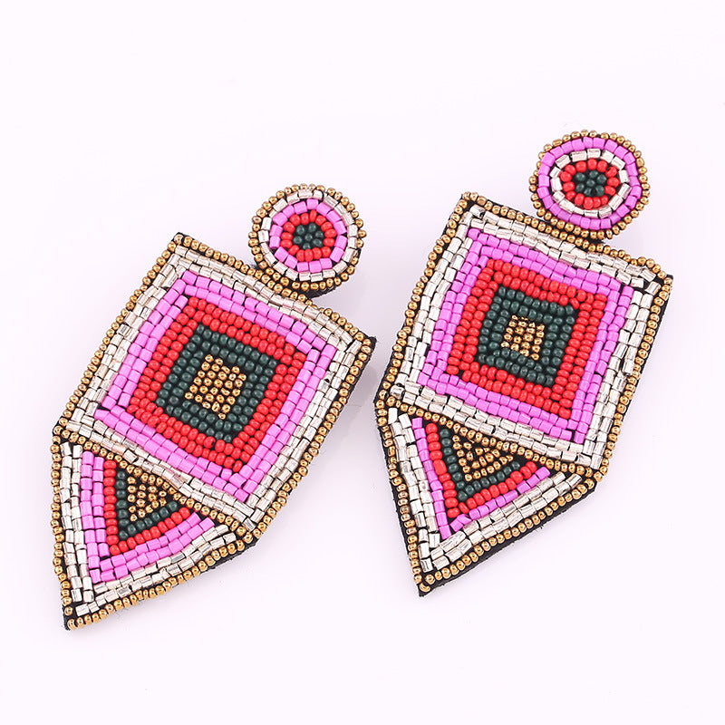Handmade rice bead earrings in pink