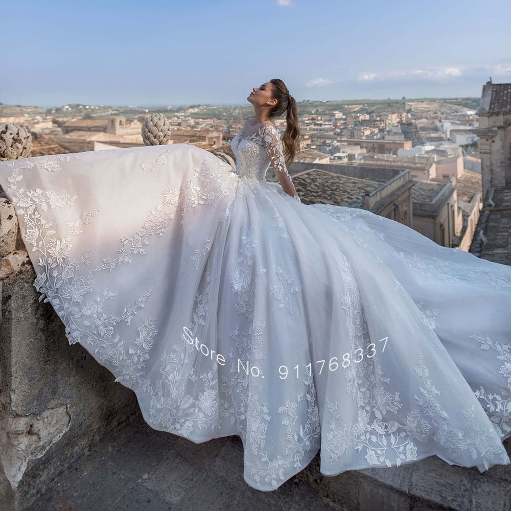 Backless Long Sleeve Ball Gown Wedding Dress with Pearls and Appliques