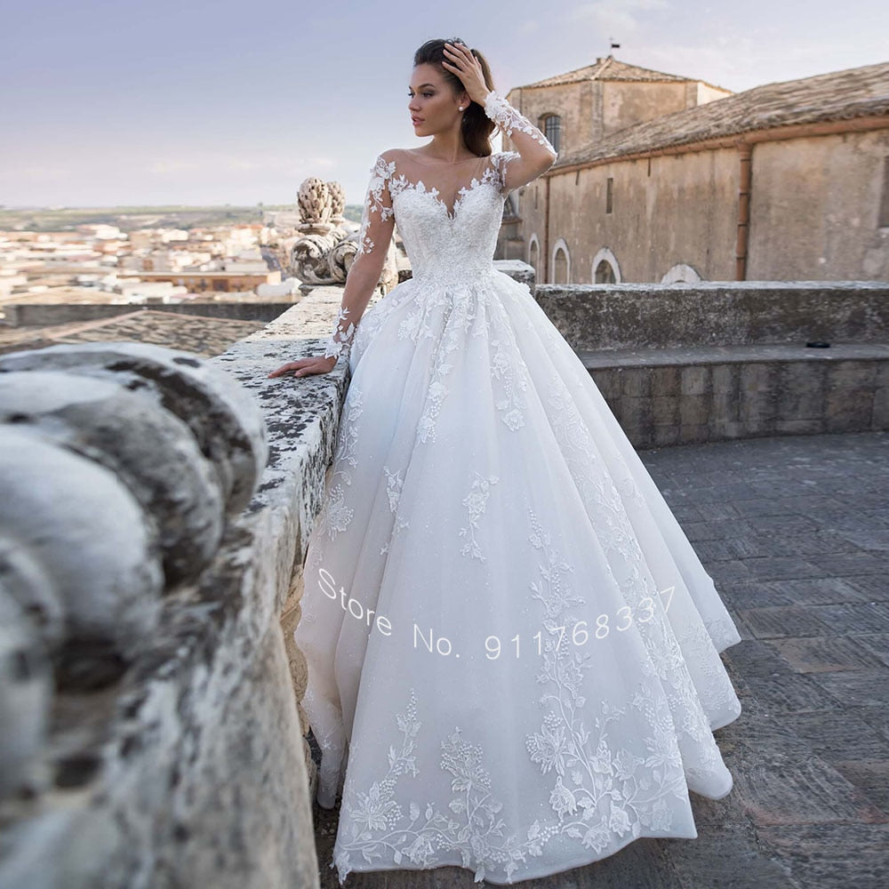 Backless Long Sleeve Ball Gown Wedding Dress with Pearls and Appliques