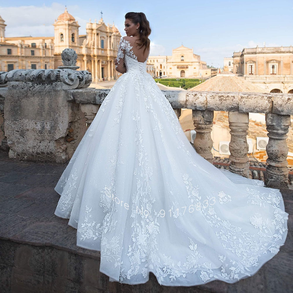 Backless Long Sleeve Ball Gown Wedding Dress with Pearls and Appliques