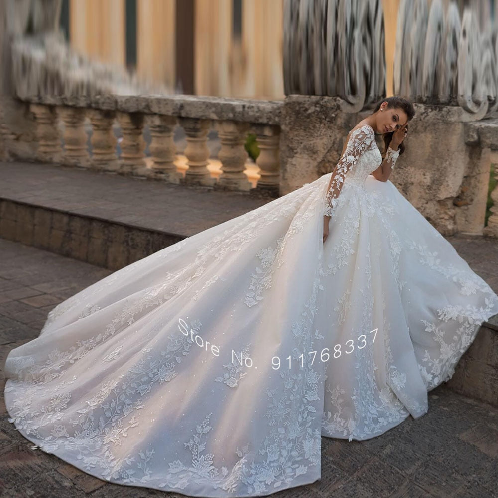 Backless Long Sleeve Ball Gown Wedding Dress with Pearls and Appliques
