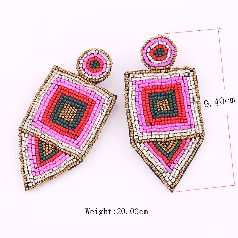 Handmade rice bead earrings in pink