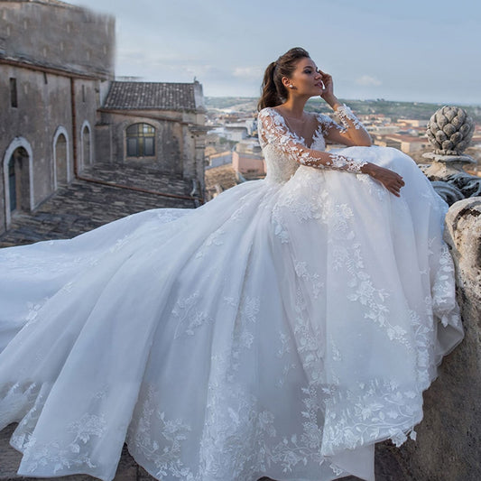 Backless Long Sleeve Ball Gown Wedding Dress with Pearls and Appliques